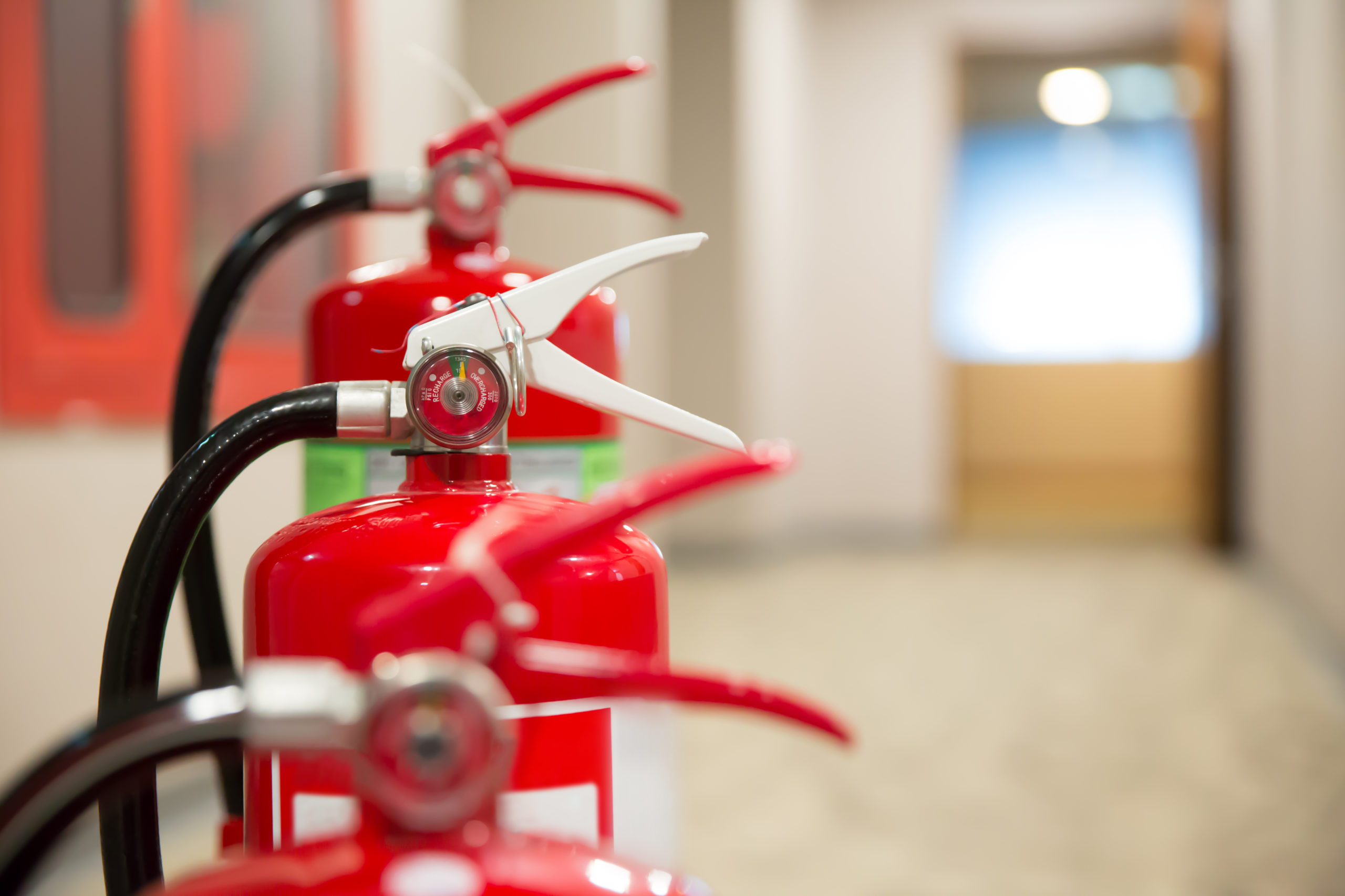 fire extinguisher on the fire escape in the building.